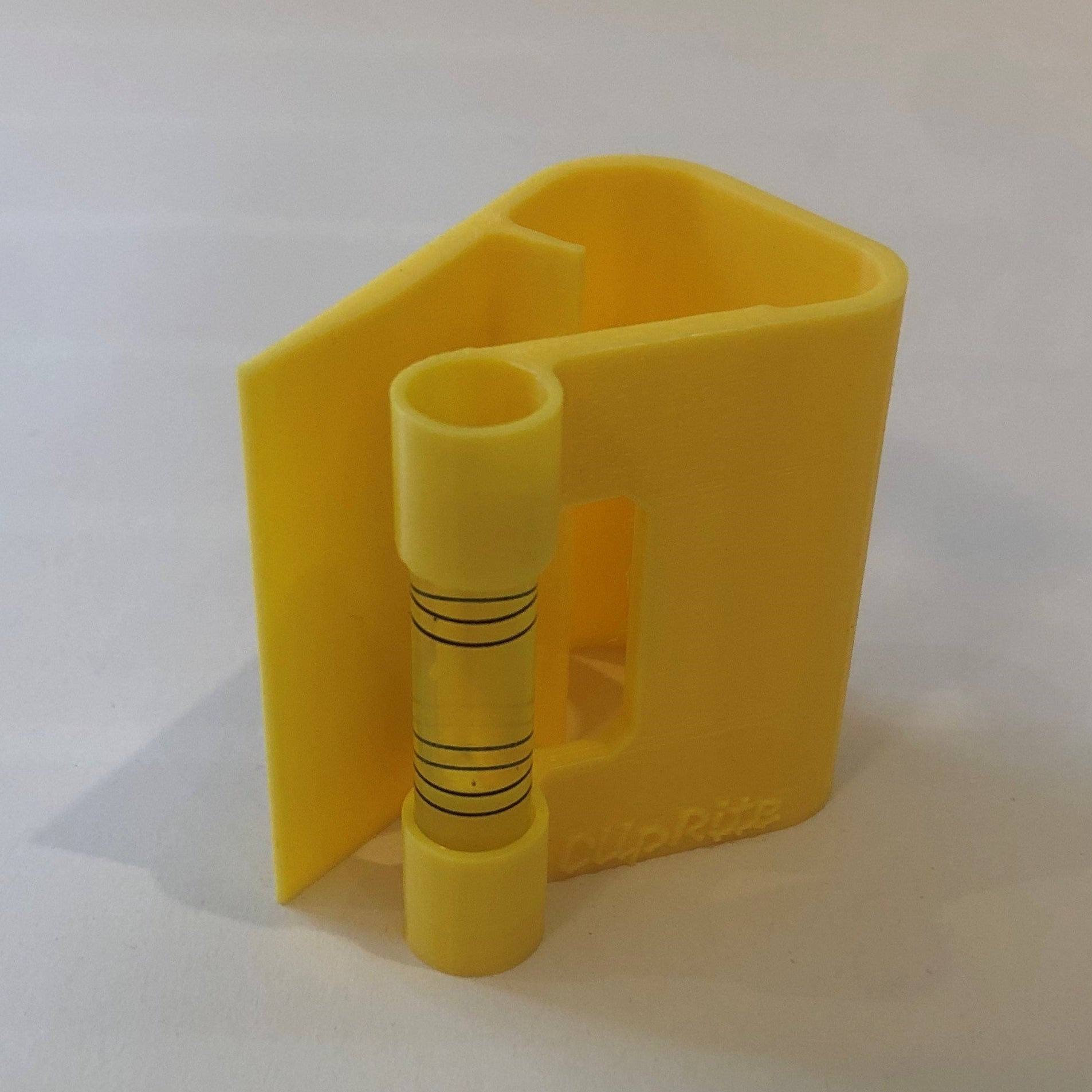 Yellow hands-free plastic clip-on level, designed for easy attachment to surfaces, featuring a built-in bubble vial for precise alignment during leveling tasks